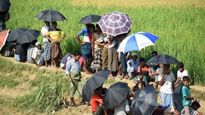 Rohingya refugees wait for relief aid at Balukhali refugee camp in the Bangladeshi district of Ukhia on October 24, 2017. Tauseef Mustafa / AFP