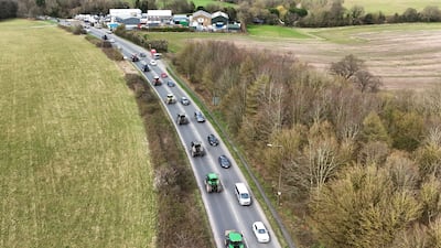 A convoy of farmers travelling in tractors on the A20 in Kent, heading for London to join the protest. PA
