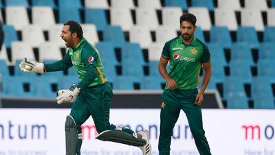 Pakistan's Sarfaraz Ahmed, left, celebrates the dismissal of South Africa's Andile Phehlukwayo. AFP