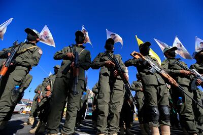 Houthi fighters, seen with pennants showing assassinated Hezbollah leader Hassan Nasrallah, have attacked Red Sea shipping in response to the war in Gaza. AFP