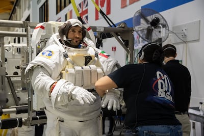 PHOTO DATE: 01-19-21 LOCATION: NBL - Pool Topside SUBJECT: Photographic coverage of UAE astronauts Hazzaa AlMansoori and Sultan AlNeyadi in Topside Suit-up for EVQ NBL 1 training in NBL/pool deck PHOTOGRAPHER: BILL STAFFORD