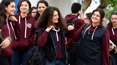 Siwar Tebourbi (C), an 18-year-old Tunisian schoolgirl, walks with colleagues as they leave school in Bizerte on November 30, 2017. Fethi Belaid / AFP