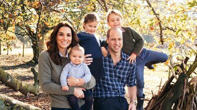 This photo released by Kensington Palace, shows the photo taken by Matt Porteous of Britain's Prince William and Kate, Duchess of Cambridge with their children Prince George, right, Princess Charlotte, center, and Prince Louis at Anmer Hall in Norfolk, east England, which is to be used as their 2018 Christmas card. AP