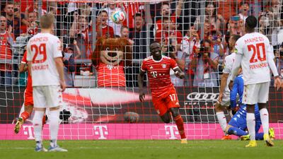 Munich's Sadio Mane celebrates after scoring the third with a penalty. EPA
