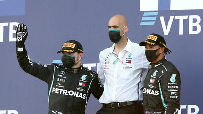 Mercedes' Valtteri Bottas, left, poses on the podium after winning the Russian Grand Prix alongside third placed Lewis Hamilton. Reuters