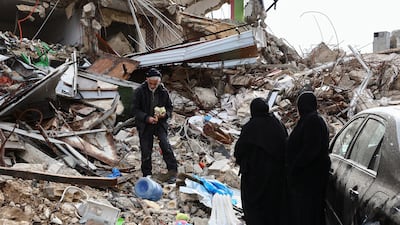Returning residents inspect the ruins of the village of Kfar Kila, southern Lebanon, as Israeli troops withdrew from most of the area. Reuters