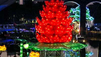 A light installation in a lake at Dubai Garden Glow. The park, which uses energy-saving lights and recycled materials, will open to the public from Wednesday. Reem Mohammed / The National