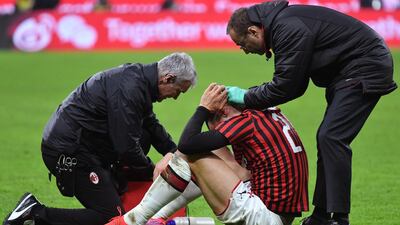 Zlatan Ibrahimovic receives treatment after taking a blow to the head. AFP
