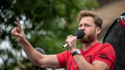 Infowars host Owen Shroyer arrives at a protest against mandates to wear masks in Austin. Reuters