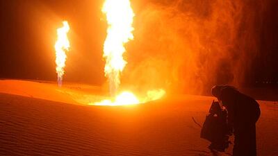 People look at flames rising from a blown pipeline at Al Sabeel, in the Egyptian city of Al Arish. Saboteurs blew up Egypt's gas pipeline to Jordan and Israel on Monday, witnesses and security sources said. Reuters