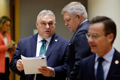 Slovakian Prime Minister Robert Fico, right, talks to Hungarian Prime Minister Viktor Orban in Brussels in February. AP