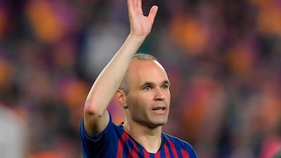 Barcelona's Andres Iniesta waves to the fans. Lluis Gene / AFP