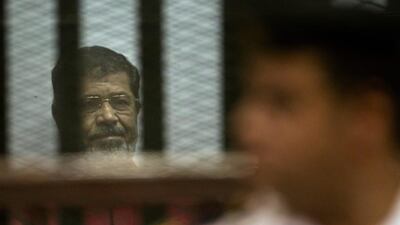 Former Egyptian president Mohammed Morsi, was sentenced by an Egyptian court to 25 years in prison on June 18, 2016. The same court also sentenced six people, including two Al-Jazeera employees, to death for allegedly passing documents related to national security to Qatar and the Doha-based TV network. Amr Nabil/AP Photo
