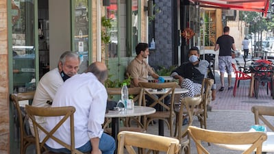 People sit at an Amman restaurant that reopened to the public on June 6 as Jordan lifted strict coronavirus restrictions after more than two months. Jordan raised $1.75 billion through a double tranche eurobond. EPA