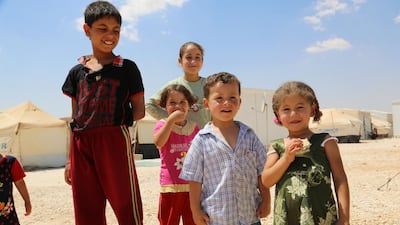 The Zaatari camp in Marfaq, south of the Syrian border, became Jordan’s first official camp for Syrian refugees fleeing violence in their country. In the photo: Aya stands with her neighbours in Zaatari camp in Jordan. She is one of 60,000 children in Zaatari camp. WFP