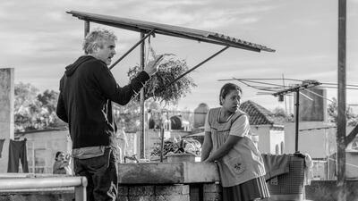 Roma director Alfonso Cuaron on set with Roma lead Yalitza Aparicio. Courtesy Netflix.