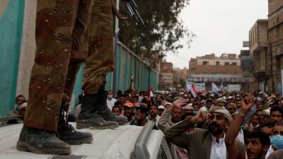 Defected army soldiers backing anti-government protesters stand guard on a car as protesters march to demand the ouster of Yemen's President Ali Abdullah Saleh in Sanaa on September 18 2011. Khaled Abdullah / Reuters