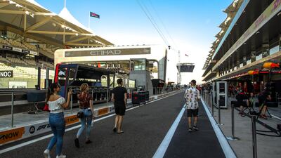 Fans walk on the tracks of Yas Marina Circuit. Victor Besa / The National