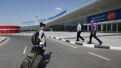A passenger walks on her way into the Dubai World Central - Al Maktoum International Airport, in Jebel Ali. Ali Haider / EPA