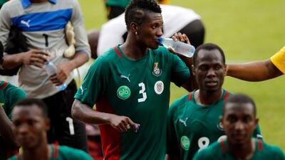 Asamoah Gyan, centre, during a training session in Franceville.