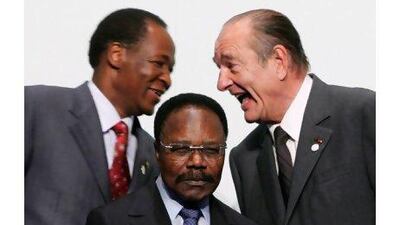 Jacques Chirac, right, talks with the president of Burkina Faso, Blaise Compaore, left, behind the Gabonese president, Omar Bongo Ondimba. PATRICK KOVARIK / AFP PHOTO