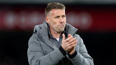 Rob Edwards, manager of Luton Town, looks dejected as he applauds the fans at full-time. Getty