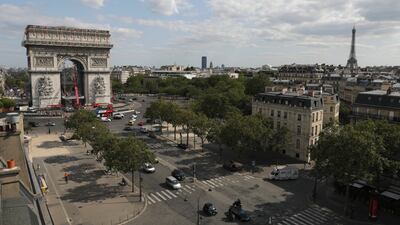 Cranes are installed at the Arc de Triomphe in Paris as workers prepare the famed Paris monument for the project called 'L'Arc de Triomphe, Wrapped'. AP