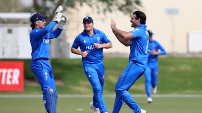 Italy's Grant Stewart celebrates the wicket of Ireland's Gareth Delany in Dubai