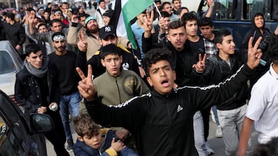 Syrians and others celebrate at the Masnaa border crossing with Lebanon after the rebels announced they had ousted President Bashar Al Assad. Reuters