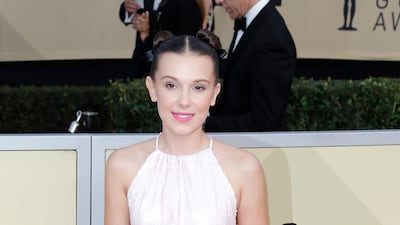 Millie Bobby Brown, wearing a pink sequined Calvin Klein dress with Converse shoes, arrives for the Screen Actors Guild Awards in Los Angeles on January 21, 2018. EPA