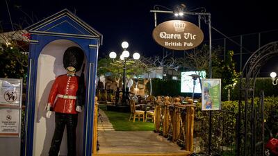 The entrance to a empty British themed sports pub is seen in the once popular Soho Square.