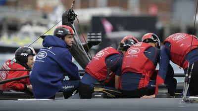 Skipper Sir Ben Ainslie, second left, of LandRover BAR heads to the start for the first day of official racing in the Americas Cup World Series. Time Ireland / AP Photo