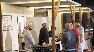 Restaurant staff run a pop-up stall at an outdoor night market. Courtesy: DCT Abu Dhabi