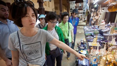 Tourists at Souk Madinat Jumeirah, in Dubai. The non-oil economy in the UAE has maintained a robust growth momentum this year. Jaime Puebla / The National