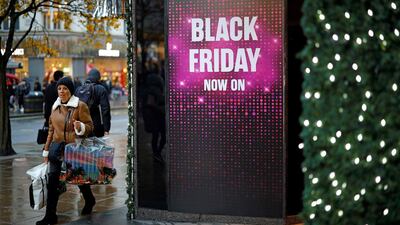 Promotions for sales discounts on Oxford Street, London, November 26, 2019. Tolga Akmen / AFP