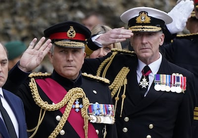 Gen Sir Nick Carter (L) and Adm Sir Tony Radakin salute at the funeral service of Maj Gen Matthew Holmes. PA
