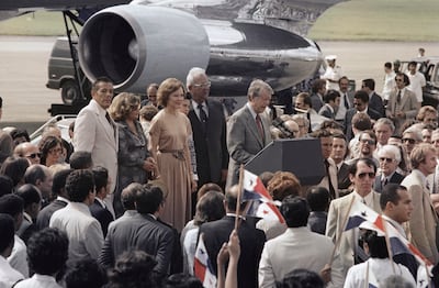 US President Jimmy Carter speaks next to his wife Rosalynn upon arrival to Panama City to sign the Panama Canal Treaty, June 16, 1978. AP