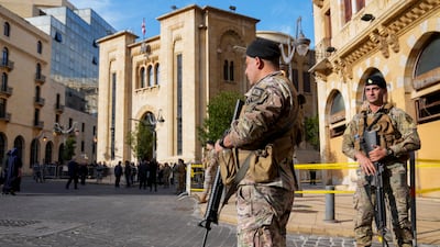 Lebanese army soldiers stand guard in front of the parliament building before a session to elect a new Lebanese president in Beirut. Lebanon's economy was severely impacted due to war with Israel. AP Photo