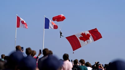 Parachutists drop in ahead of the Canadian commemorative ceremony at the Juno Beach Centre as part of events to mark the 80th anniversary of the D-Day landings in France. AFP