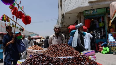 An Afghan date seller waits for customers in the run-up to Ramadan in Kabul. AFP