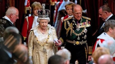 Queen Elizabeth II holding the hand of her husband Prince Philip, Duke of Edinburgh as she arrives to address to the House of Lords, during the State Opening of Parliament in Westminster. Today Prince Philip Duke of Edinburgh will celebrate his 90 birthday. EPA