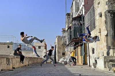 in Aleppo, Syrian youths enjoy parkour but face dangers from the detritus of seven years of war. AFP