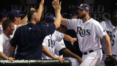 Dan Wheeler of Tampa Bay is greeted by teammates as he returns to the dugout after being relieved by David Price in the second game against the Philadelphia Phillies of the 2008 MLB World Series overnight in St Petersburg, Florida.