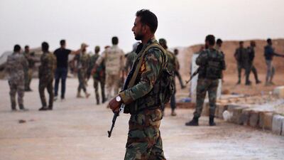 A handout picture released by the official Syrian Arab News Agency (SANA) shows Syrian government forces gathering AT Tabqa air base in Syria's Raqqa region. The Syrian regime sent troops towards the Turkish border today to contain Ankara's deadly offensive against the Kurds, stepping in for US forces due to begin a controversial withdrawal. AFP