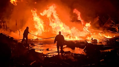 Lebanese civil defence personnel tackle a blaze caused by an Israeli attack on a solar power site, in the southern city of Tyre. AFP