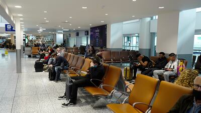 Passengers in a waiting lounge at Bristol Airport on October 3 ahead of the relaxation of travel rules in the UK. Getty Images