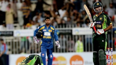 Mohammad Hafeez, left, returned to form by scoring a hundred in Sharjah on Wednesday night. Satish Kumar / The National