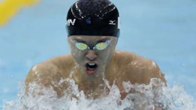 Kitajima swims to the gold in the men's 100-metre breaststroke final.