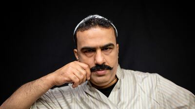 Iraqi actor Youssef al-Hajjaj poses for a picture on the set of a parody sketch video of Bab al-Hara, an adaptation of an iconic long-running Syrian television drama, in Iraq's southern port city of Basra on April 22, 2020. AFP / Hussein Faleh