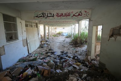 Pro-Assad slogans are painted inside a destroyed building in Al Zabadani. Ahmad Fallaha / The National